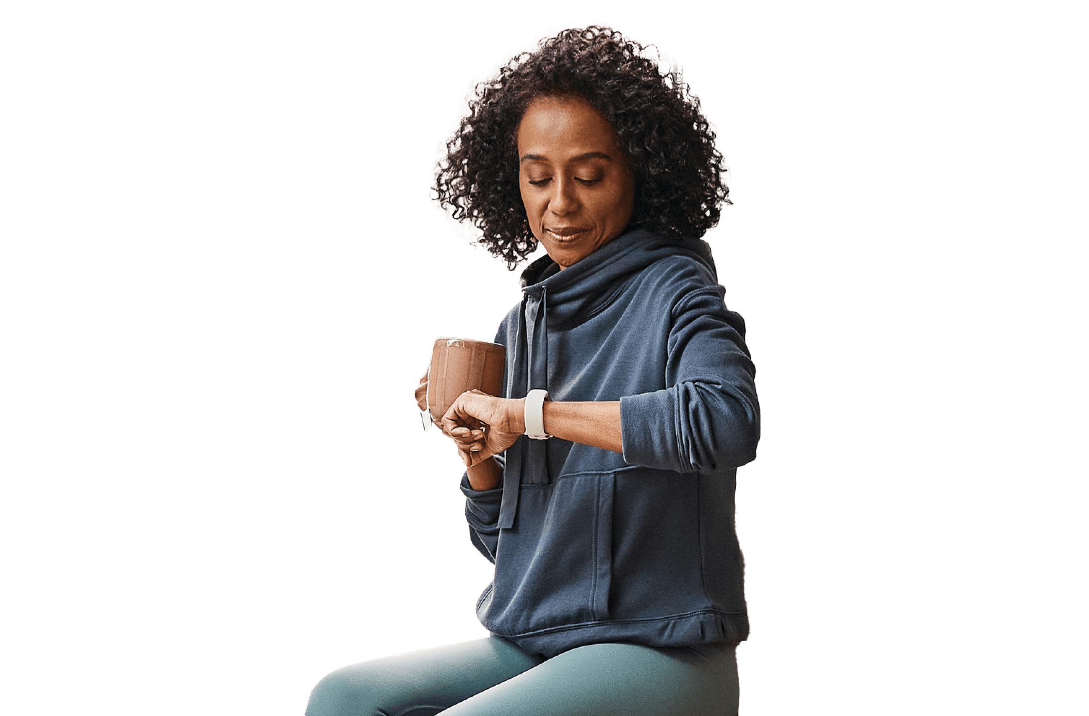 Woman with a mug checking her watch